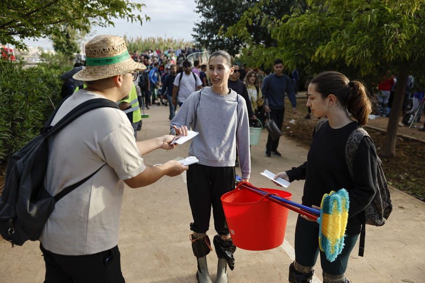 People volunteer to help people affected by flash floods in Valencia